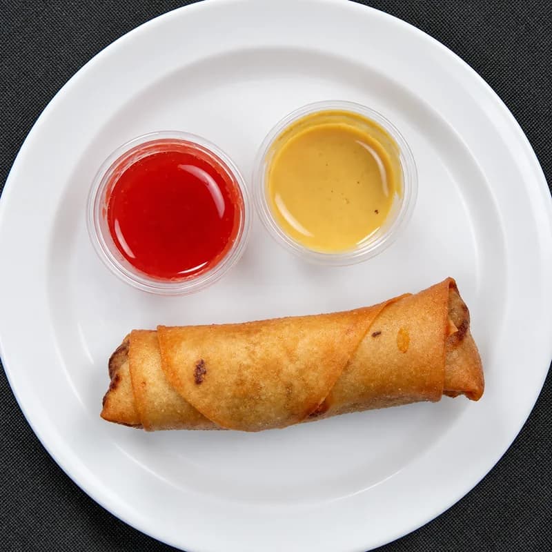 Two egg rolls with sweet and sour sauce and hot mustard