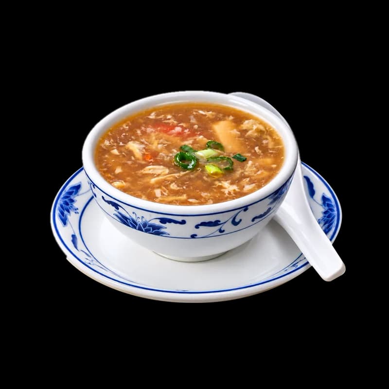Hot and sour soup in a blue and white bowl