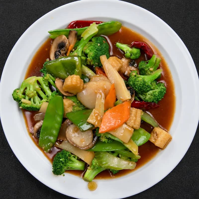 Spicy Hunan mixed vegetables with broccoli, mushrooms, baby corn and snow peas